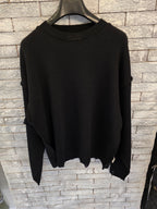 Maglione con rotture