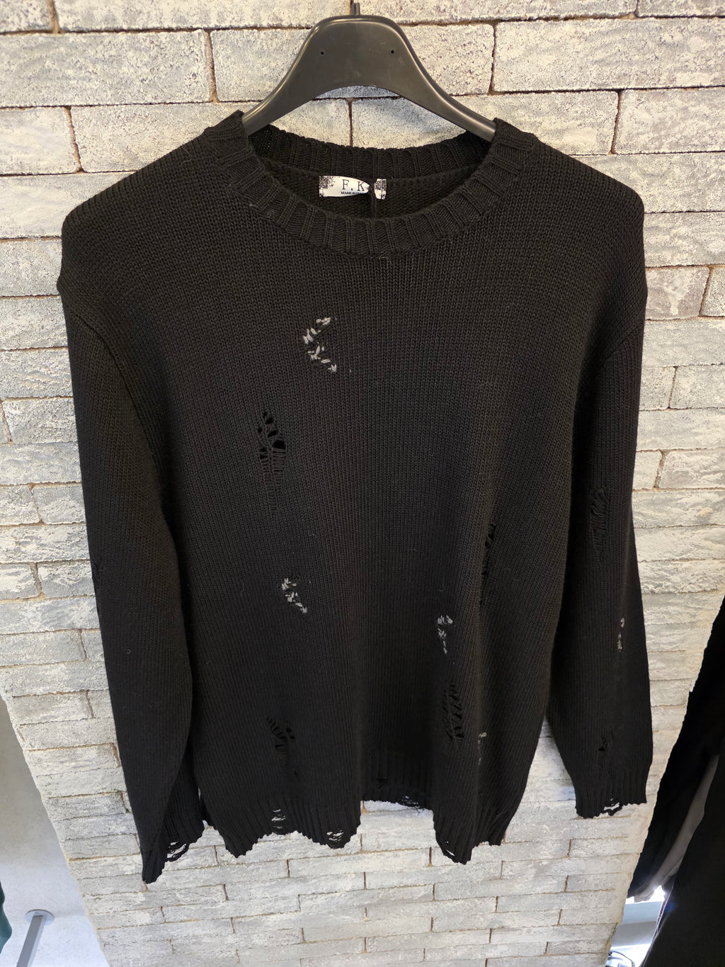 Maglione con rotture