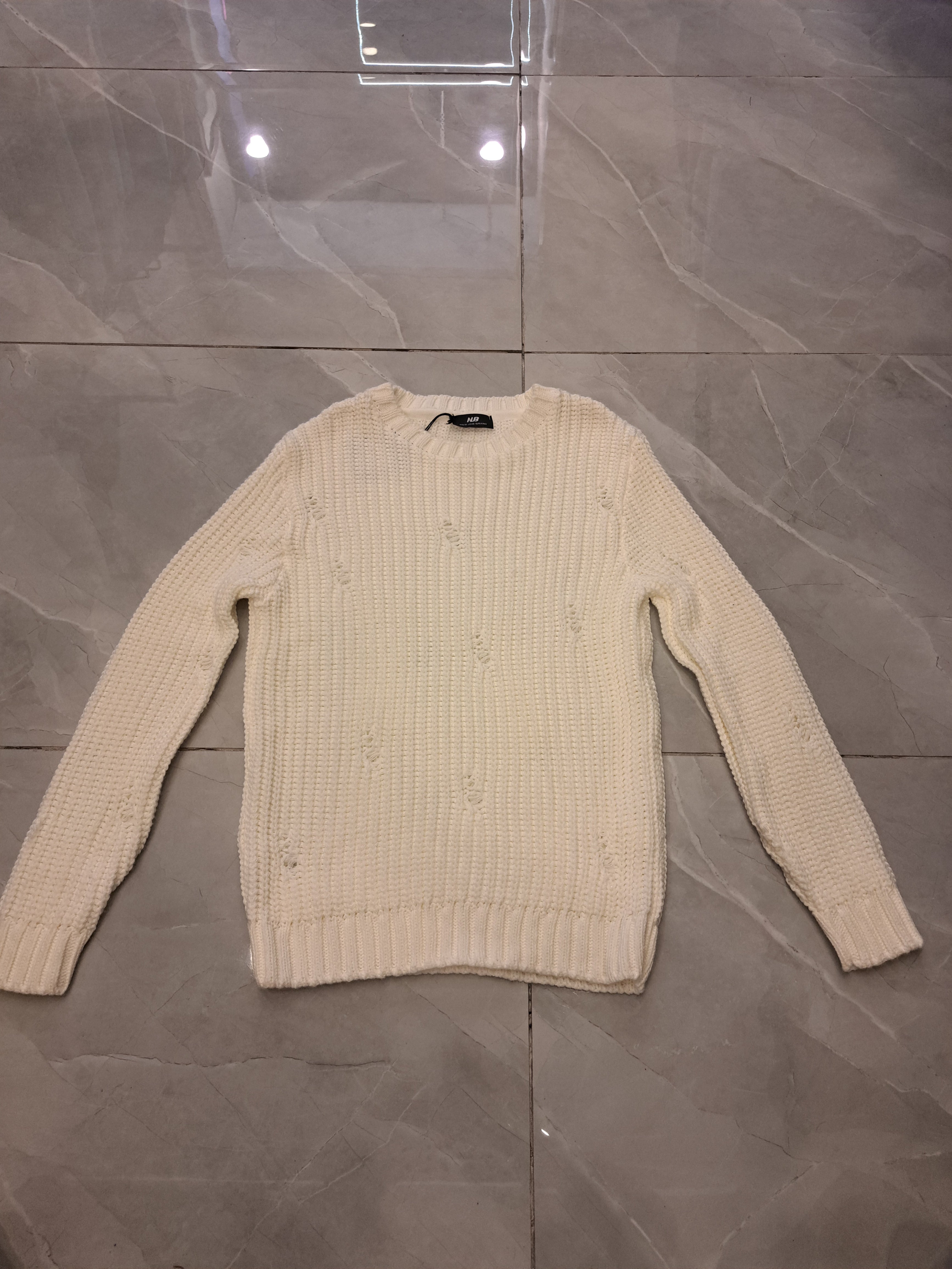 Maglione con rotture